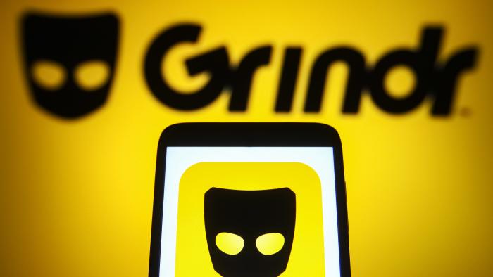 UKRAINE - 2021/08/31: In this photo illustration a Grindr logo is seen on a smartphone and a pc screen. (Photo Illustration by Pavlo Gonchar/SOPA Images/LightRocket via Getty Images)